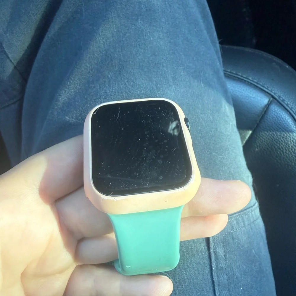 Smartwatch with Teal Band and Peach Case - Apple Watch